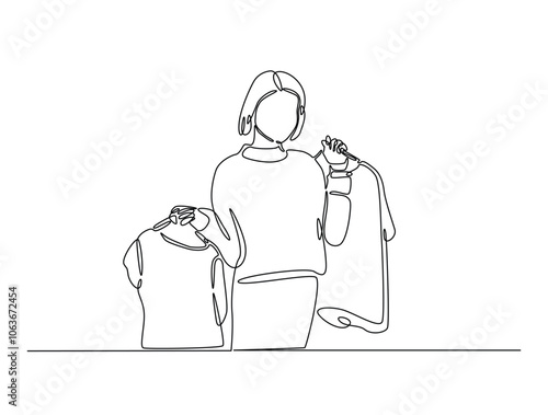 Continuous one line drawing of woman holding clothes on hangers. Shop assistant holding hangers with clothes single line draw vector illustration. Editable vector.