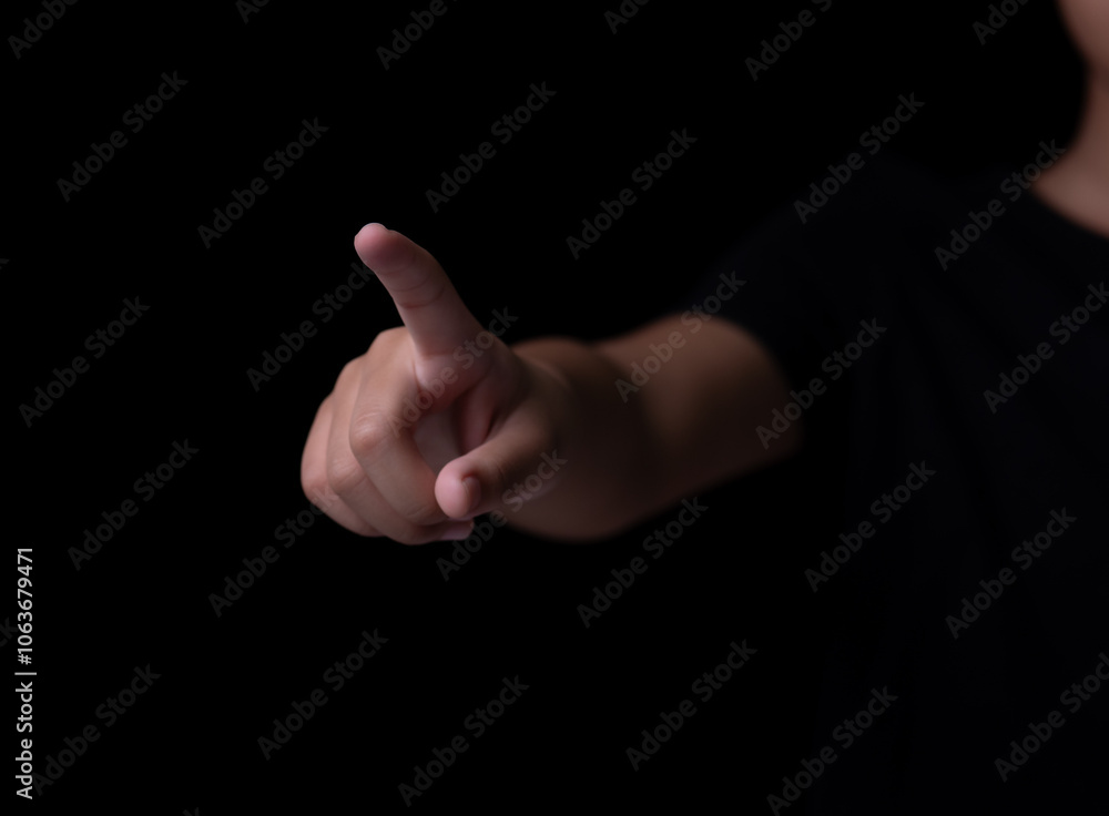 Women pointing or pressing something on black background Women pointing or pressing something on black background