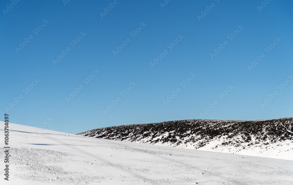 A beautiful view of snow-covered mountains, showcasing the serene and majestic landscape of winter.