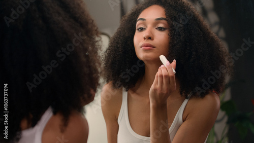 Quadro em tela Beautiful African American woman looking in mirror reflection morning beauty rou