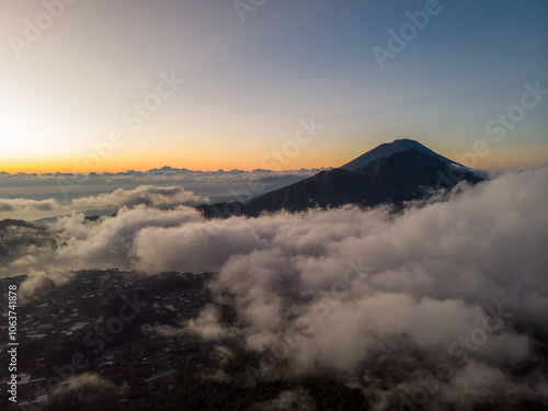 A photo of a mountain covered in clouds