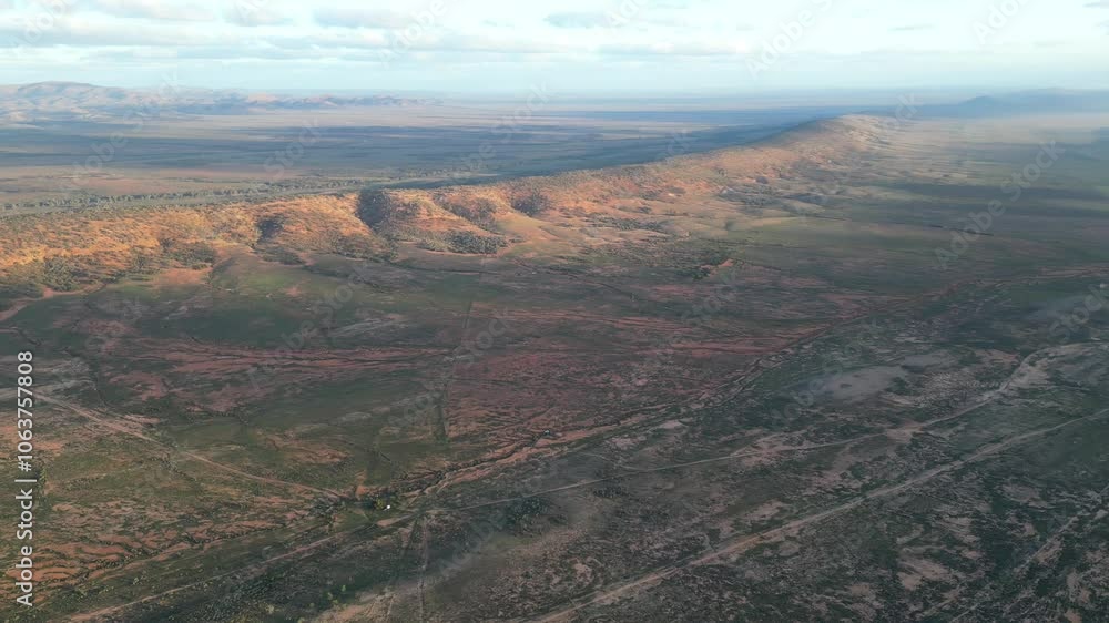 The Elder Range landscape at sunrise with a blue cloudy sky in Flinders Ranges, South Australia The Elder Range landscape at sunrise with a blue cloudy sky in Flinders Ranges, South Australia