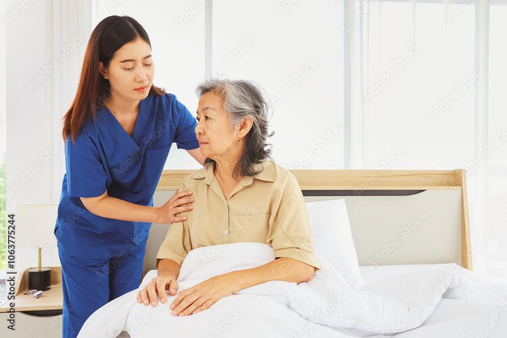 Female doctor nurse take care elderly female patient who is being treated for discomfort due congenital disease gently supporting her shoulder to help her sleep : Elderly health insurance. Female doctor nurse take care elderly female patient who is being treated for discomfort due congenital disease gently supporting her shoulder to help her sleep : Elderly health insurance.