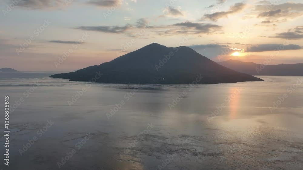 The sun sets over Pulau Pura and the Pantar Strait, separating the islands of Pantar and Alor, Indonesia. This beautiful area, in the Lesser Sunda Islands, harbors extraordinary marine biodiversity. The sun sets over Pulau Pura and the Pantar Strait, separating the islands of Pantar and Alor, Indonesia. This beautiful area, in the Lesser Sunda Islands, harbors extraordinary marine biodiversity.