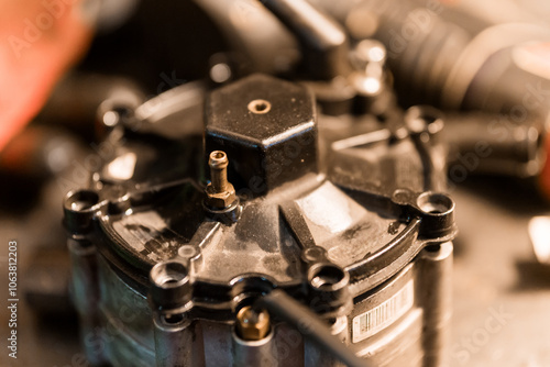 Detailed Close-Up of a Mechanical Fuel Pump Component on a Workbench