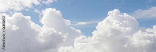 Clear blue sky with fluffy white clouds on a sunny day, serene, outdoor