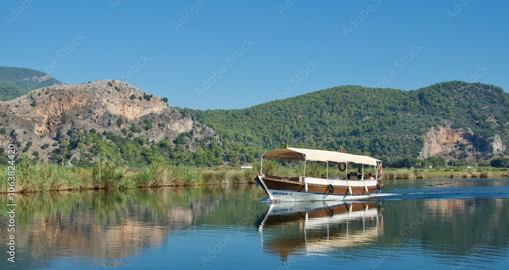 Commercial boat running along Dalyan River in Turkey