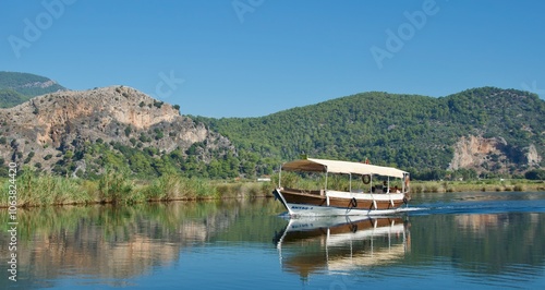 Obraz na płótnie Commercial boat running along Dalyan River in Turkey w salonie