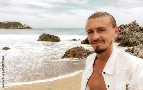 Selfie with rocks cliffs view waves beach Puerto Escondido Mexico. photo