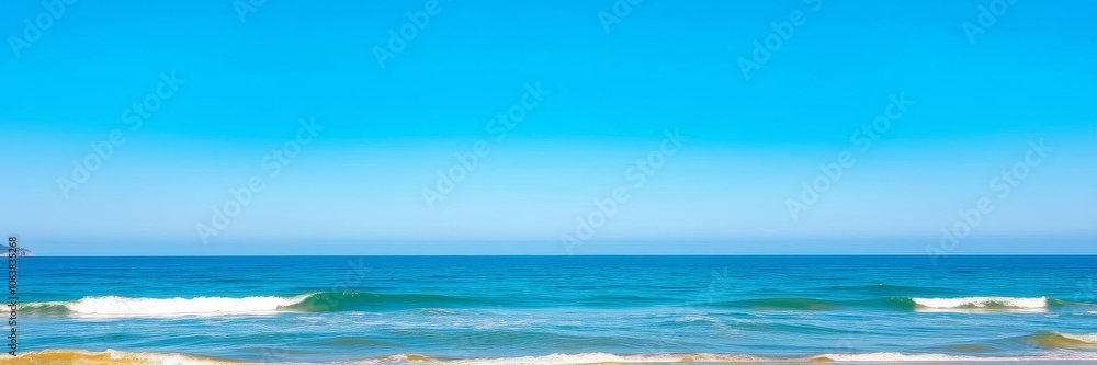 Obraz premium A serene ocean background with soft waves gently breaking on a sandy shore, under a clear blue sky, coast, seaside