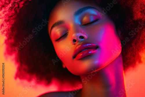 closeup portrait of woman with closed eyes under red and blue neon lights