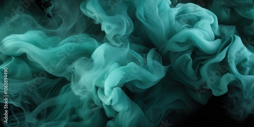 Abstract swirls of teal smoke dance in the dark, a captivating display of ethereal beauty