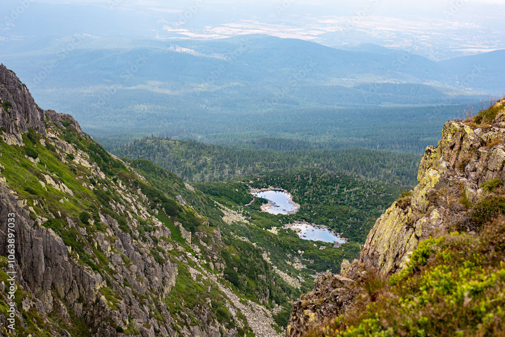 Fototapeta premium Sniezne Kotly in the Karkonosze Mountains, Poland, offers breathtaking views of rugged peaks and valleys
