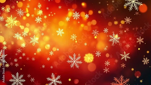 Abstract Christmas background with white snowflakes on a red and gold bokeh background.