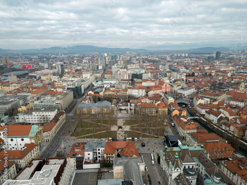 Panorama of Ljubljana city center in the winter. Aerial view with Kongresni trg square    on a  gloomy cold cloudy day. Public park surrounded by historical buildings. Capital city of Slovenia.