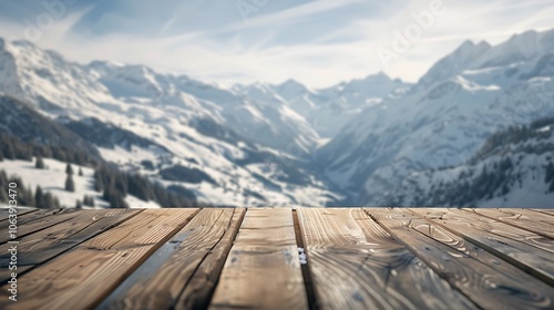 Wooden table top in focus against a white, blurred backdrop of Switzerland's snowy mountain landscape, perfect for product display.