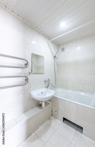 Wallpaper Mural Bright Elegant Home Bathroom Interior Design With White Sink. Mirror and Faucet. LED Lights. Shower Area, Tiled Floor and Walls. Heater Torontodigital.ca