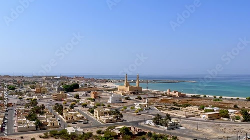 coastal view of Bukha city with traditional architecture and a mosque, Musandam, Oman photo