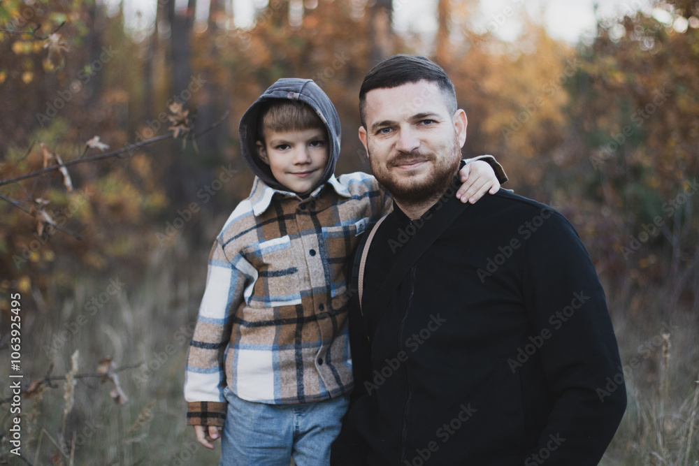 Dad with son in the autumn park Dad with son in the autumn park