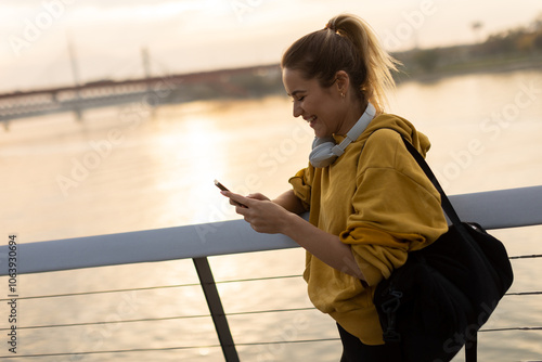 A woman in a yellow hoodie ...
