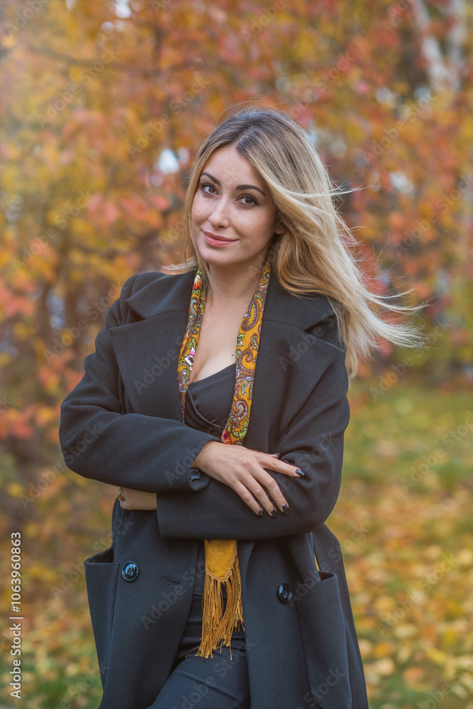 Blonde hair lady in black wool coat and golden scarf, fashionable trends for women, real photo outdoor portrait Blonde hair lady in black wool coat and golden scarf, fashionable trends for women, real photo outdoor portrait