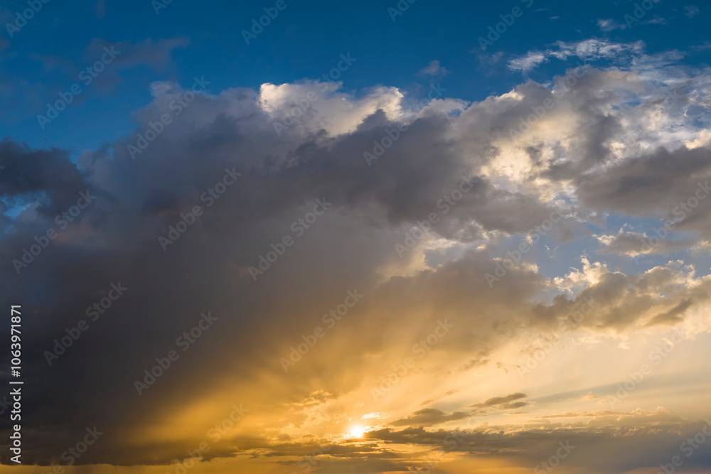 Obraz premium Amazing sunset skyscape. Evening sky with bright colorful orange and yellow clouds