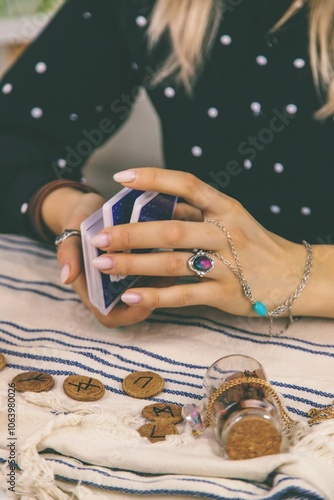 A fortune teller reads with tarot cards. Selective focus. photo