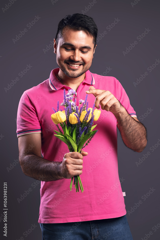 Portrait of Brazilian man wearing polo shirt in pink Portrait of Brazilian man wearing polo shirt in pink