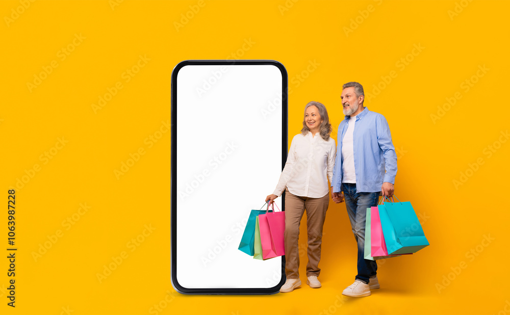 A cheerful older couple stands side by side, holding shopping bags in vibrant colors. They are positioned next to a large blank smartphone screen, set against a lively yellow backdrop. A cheerful older couple stands side by side, holding shopping bags in vibrant colors. They are positioned next to a large blank smartphone screen, set against a lively yellow backdrop.