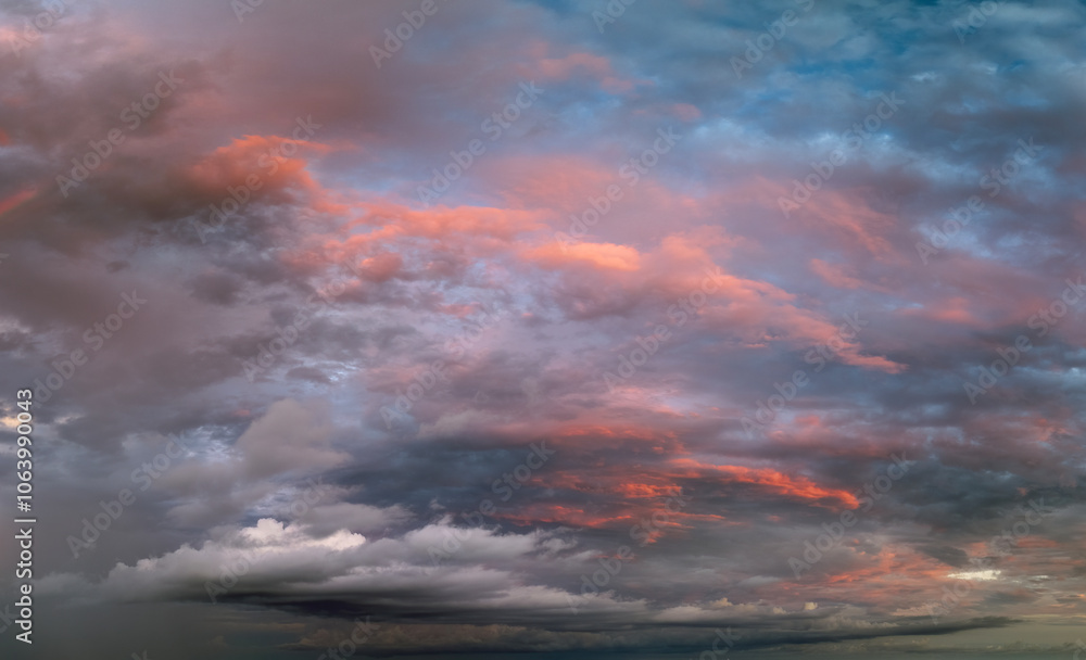 Dramatic sunset sky covered with colorful yellow clouds. Panoramic skyscape Dramatic sunset sky covered with colorful yellow clouds. Panoramic skyscape