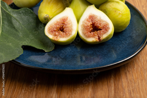 Fresh green figs on blue plate 