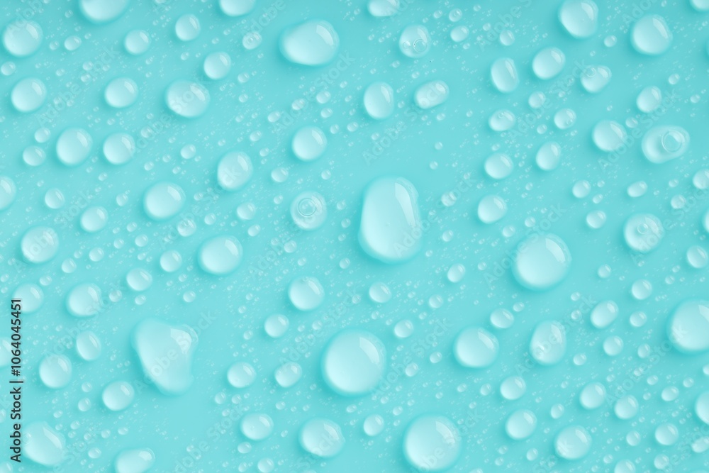 Water drops on turquoise background, top view Water drops on turquoise background, top view