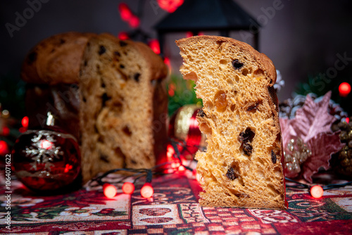 Christmas table with panettone, beautiful table decorated with Christmas objects and a delicious panettone, selective focus.