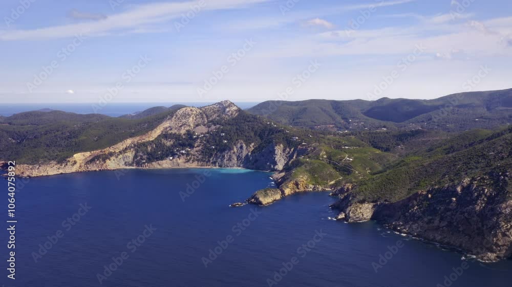 Ibiza Coast Landscape with Bays, Deep Turquoise Water, and Clear Blue Skies – Flyover Ibiza Coast Landscape with Bays, Deep Turquoise Water, and Clear Blue Skies – Flyover