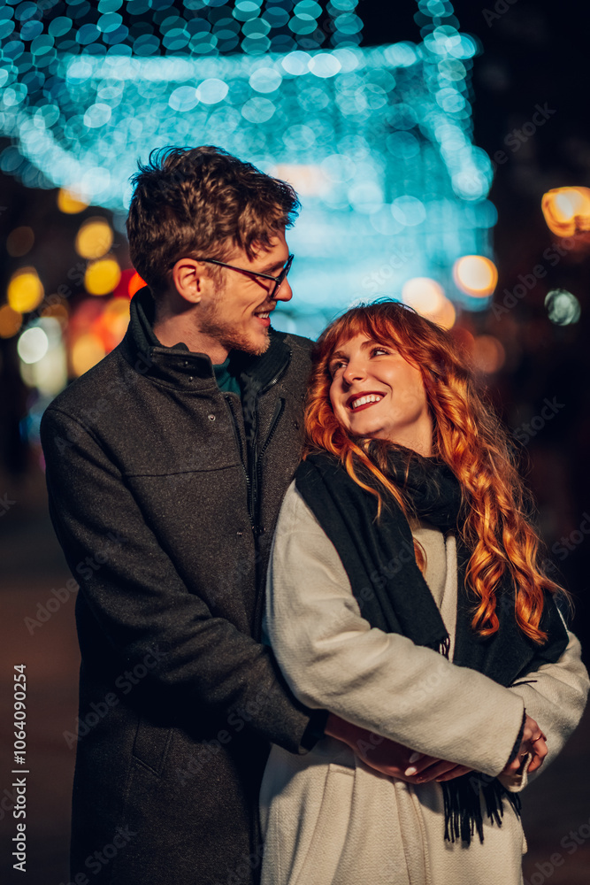 Romantic couple is hugging on street on christmas or new year's eve. Romantic couple is hugging on street on christmas or new year's eve.