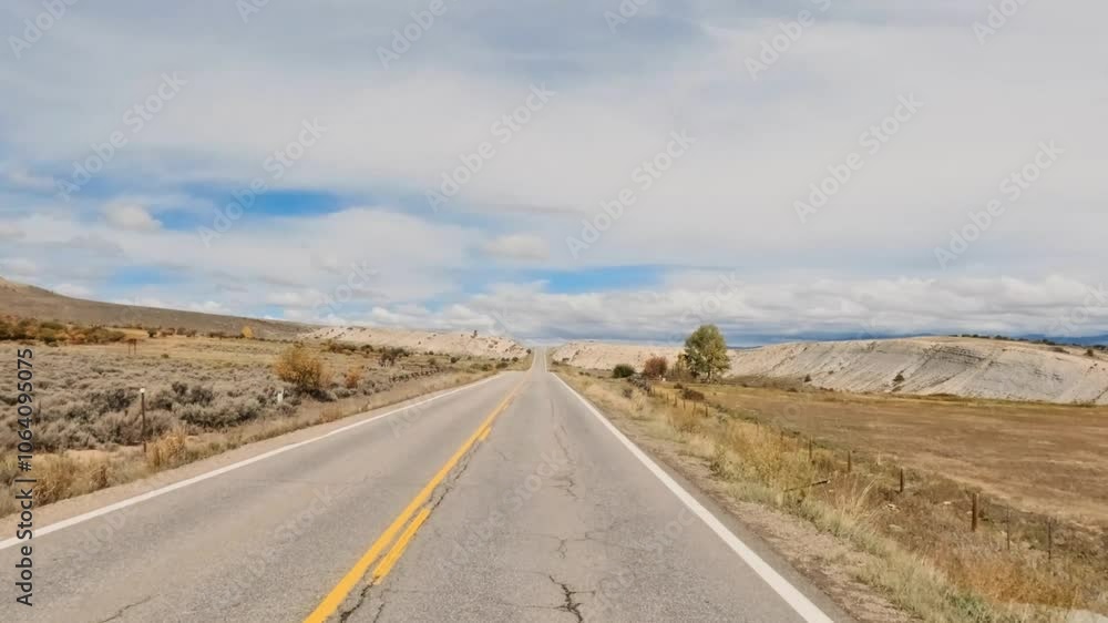 Immersive drivers point of view traversing rural Colorado on a cloudy afternoon in early autumn. Immersive drivers point of view traversing rural Colorado on a cloudy afternoon in early autumn.