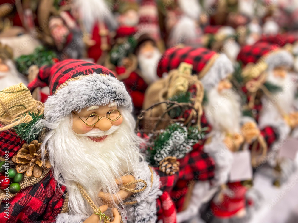 Lots of Santa Claus dolls in costume with long white beard. Christmas and New Year holidays traditional decorations. Lots of Santa Claus dolls in costume with long white beard. Christmas and New Year holidays traditional decorations.