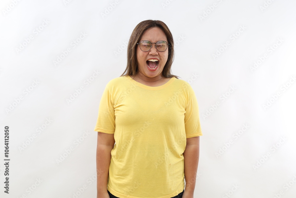 Asian woman screams loudly expresses rage keeps mouth widely opened. Human emotions and feelings concept isolated on white background