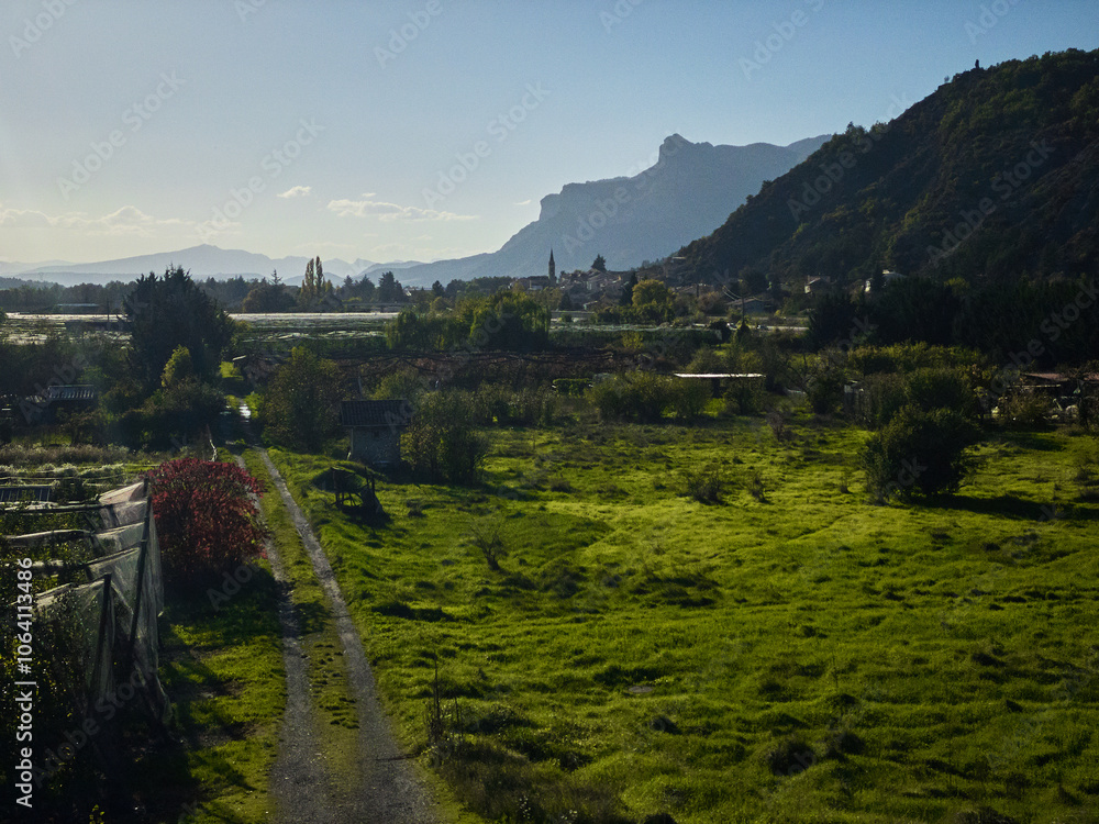 Obraz premium landscape with a village and mountains