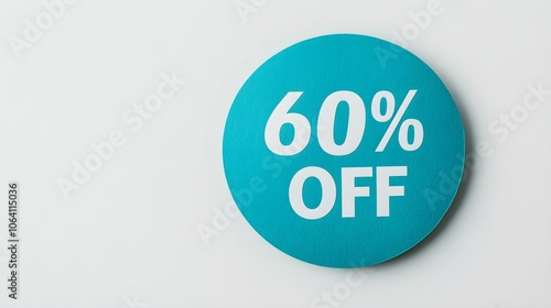 White '60% OFF' Text on a Turquoise Round Paper Note. White Background with Copy Space