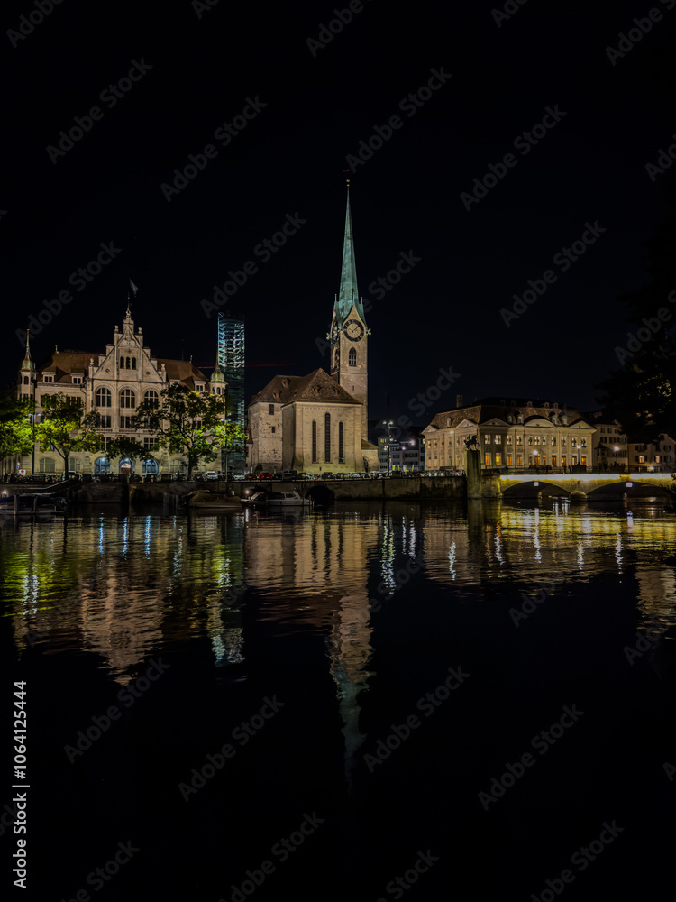 Beautiful aerial view of the city of Zurich in Switzerland at night - the Limmat River and its iconic churches, buildings rivers and Clocks. Beautiful aerial view of the city of Zurich in Switzerland at night - the Limmat River and its iconic churches, buildings rivers and Clocks.