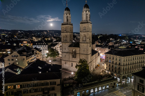 Beautiful aerial view of the church of Grossmünster in the city of Zurich in Switzerland al night  photo