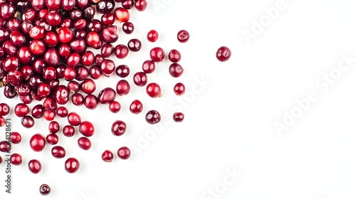 A pile of fresh cranberries on a white background.