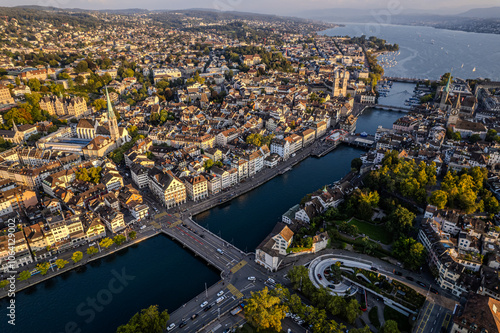 Beautiful aerial view of the city of Zurich in Switzerland - the Limmat River and its iconic churches, buildings rivers and Clockes. photo