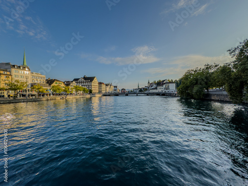 Beautiful aerial view of the city of Zurich in Switzerland - the Limmat River and its iconic churches, buildings rivers and Clockes. photo