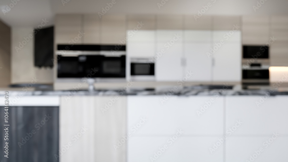 Blurred view of a modern kitchen with white cabinets and a black countertop. Blurred view of a modern kitchen with white cabinets and a black countertop.