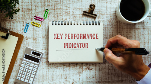 There is notebook with the word Key Performance Indicator. It is as an eye-catching image.