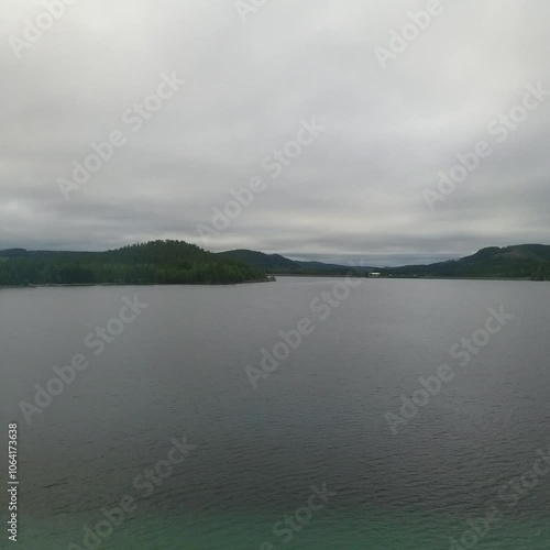 A lake seen through a Train window