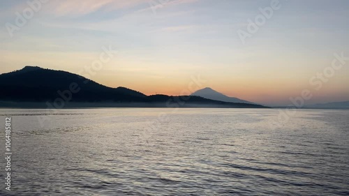 View of the island from the sea in the morning. the natural beauty of the sunrise. Manado Islands, Indonesia - October 30th 2024