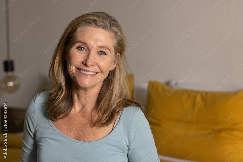 senior woman smiling at home, enjoying cozy holiday atmosphere with decorations senior woman smiling at home, enjoying cozy holiday atmosphere with decorations